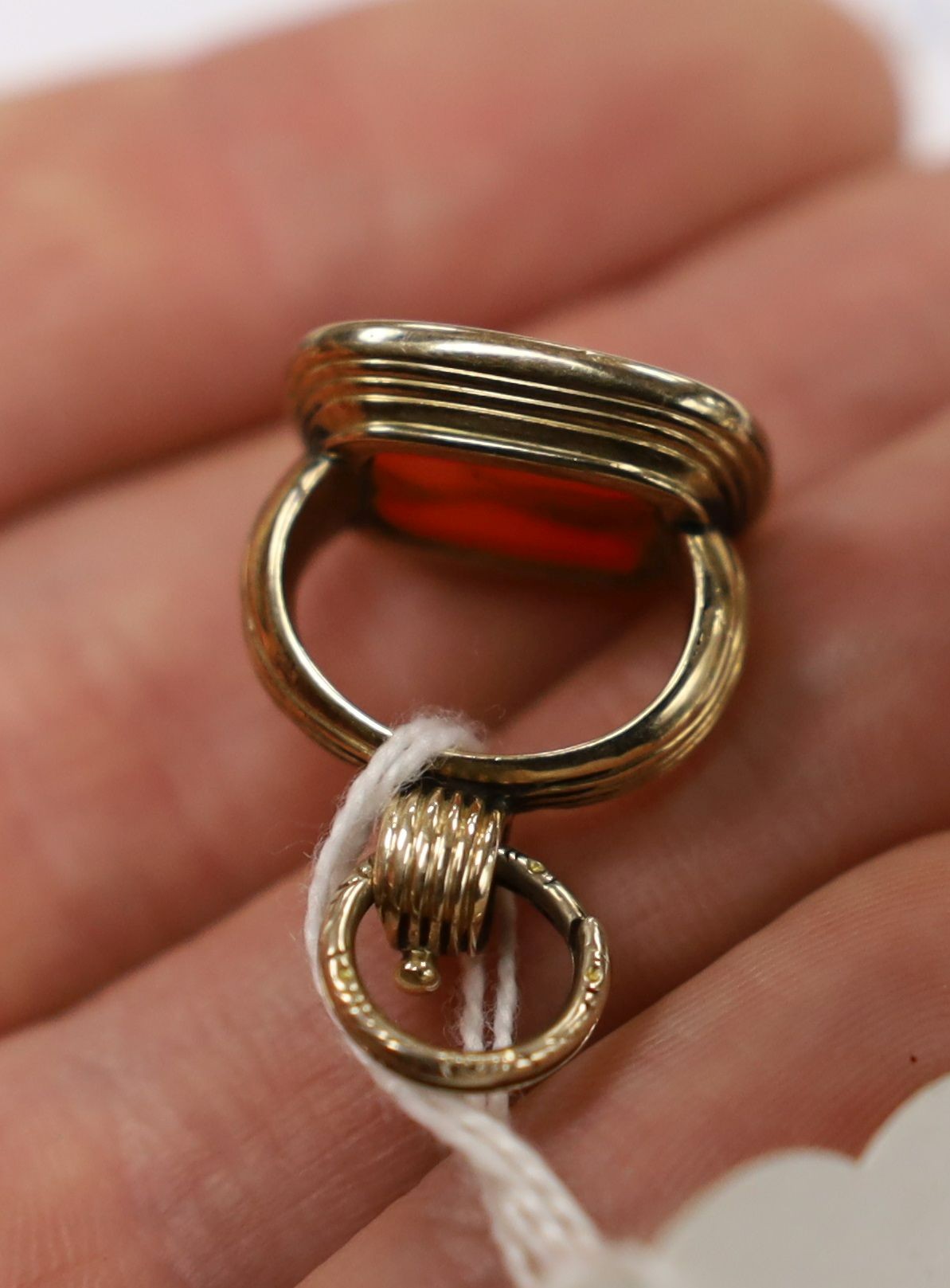 A Victorian yellow metal overlaid seal and and intaglio carnelian set seal, 21mm and a yellow metal and agate set brooch.